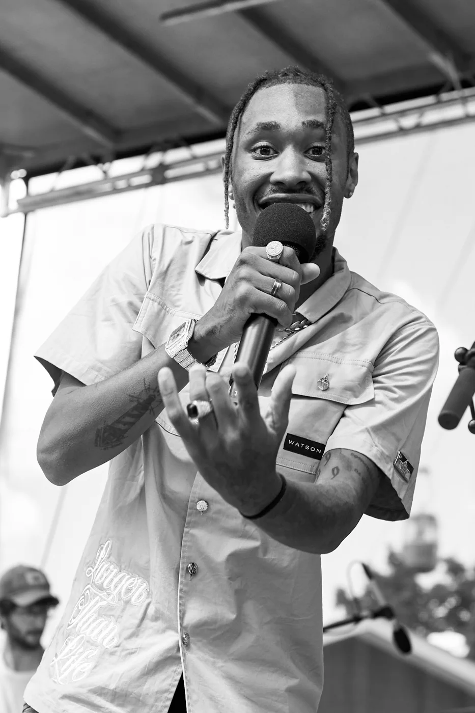 Abraham Westlund singing into a microphone on stage