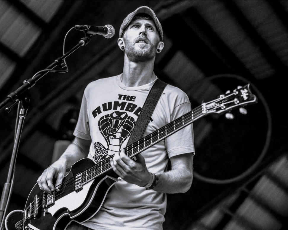 Ryan Donahoe playing bass on stage